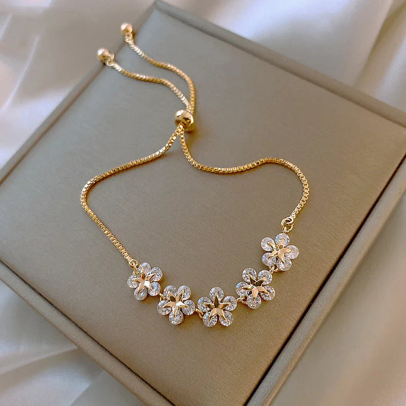 Pulsera de margaritas doradas