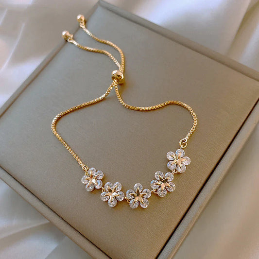 Pulsera de margaritas doradas